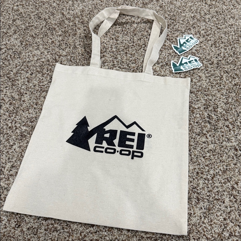 REI Co-op Tote Bag in Natural with REI Logo on one side and brooks logo on other